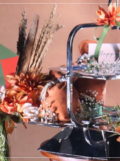 A close-up of the two-tiered Lohri hamper, showing the 'Happy Lohri' card and festive decorations.