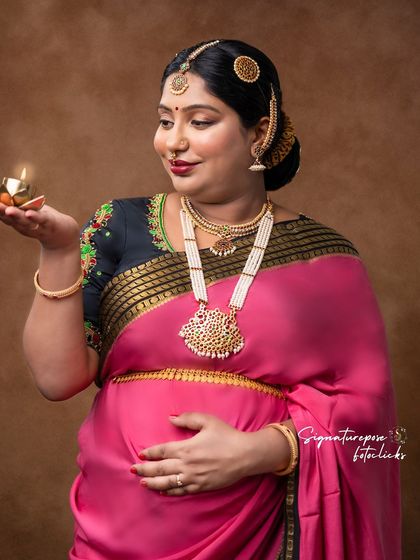 A close-up on the mother's glowing face as she holds the lamp, creating a warm and intimate feel.