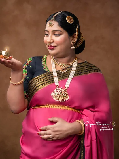 A close-up on the mother's glowing face as she holds the lamp, creating a warm and intimate feel.