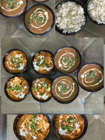 A top-down view of a bulk order for Dal Makhni and Kadai Paneer. This is perfect for parties where you want to serve food in separate containers.