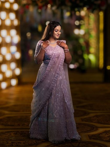 A candid and graceful portrait of the bride. The soft lighting and her gentle expression create a timeless and beautiful wedding photo.