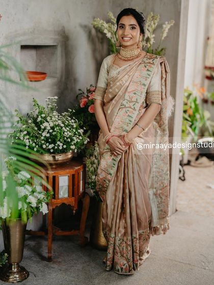 Another view of this elegant ensemble, showing how the custom blouse and saree drape beautifully for a graceful silhouette.