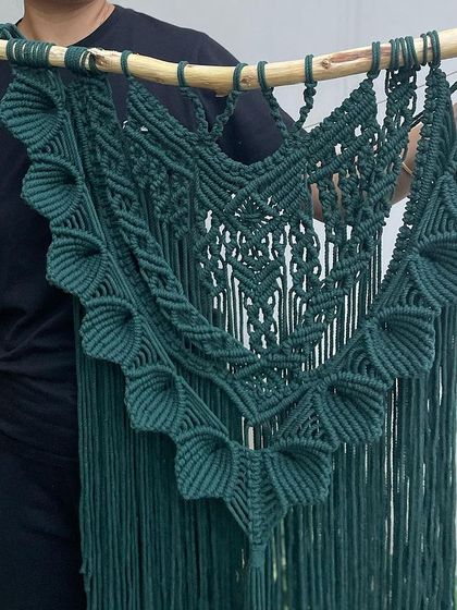 Here is a closer look at the 'Heer' tapestry, held up so you can see its full size and shape. The deep green color is so rich and looks amazing against a light-colored wall.