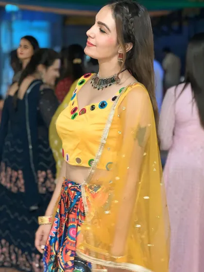 A candid moment from our Navratri Dandiya night. The festive atmosphere was filled with music, dance, and smiles.