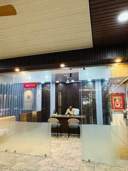 Another view of our front desk and office area, showcasing how different louver styles can be used on ceilings and walls.