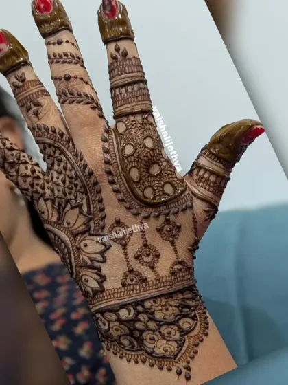 An intricate back-hand design with a mix of patterns. The detailed work on the fingers and palm creates a very rich look.