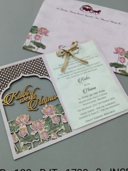 This card features a laser-cut archway revealing a pond of lotus flowers. The couple's names are cut from gold acrylic, adding a luxurious and personalized touch.
