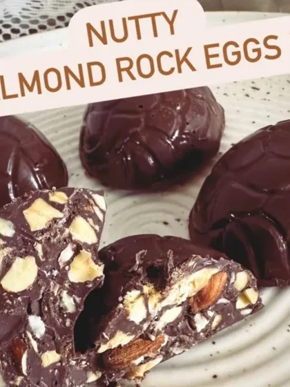 This is a look inside my nutty almond rock eggs. They are packed with crunchy roasted almonds in rich dark chocolate, offering a satisfying crunch in every bite.