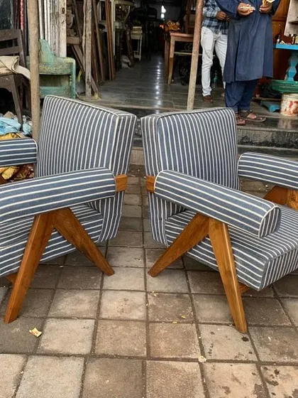 A different perspective on the pair of striped lounge chairs.