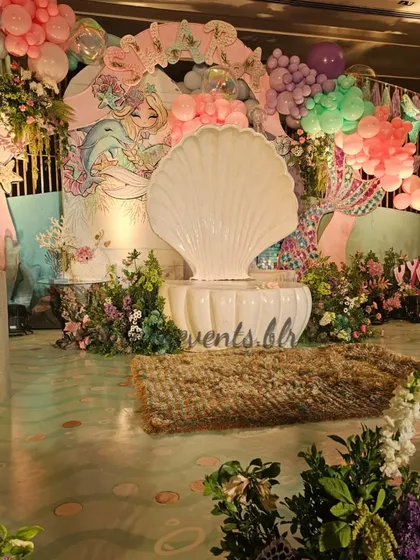 Welcome to our enchanting underwater kingdom! This mermaid-themed first birthday was a deep dive into detail, with a grand seashell throne, shimmering floors, and an ocean of balloons. I love creating these magical, immersive worlds for little ones.