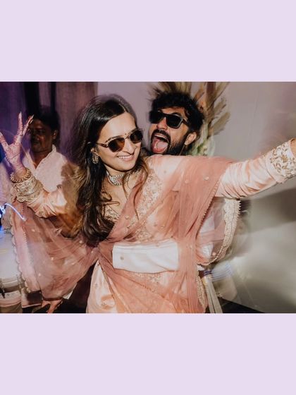 Cool shades and goofy faces. A fun, candid moment from Ankita and Rahat's engagement party.
