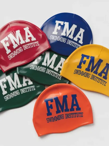 A colorful assortment of our FMA swimming caps. We provide high-quality silicone caps in various colors, available for all students at our institute.