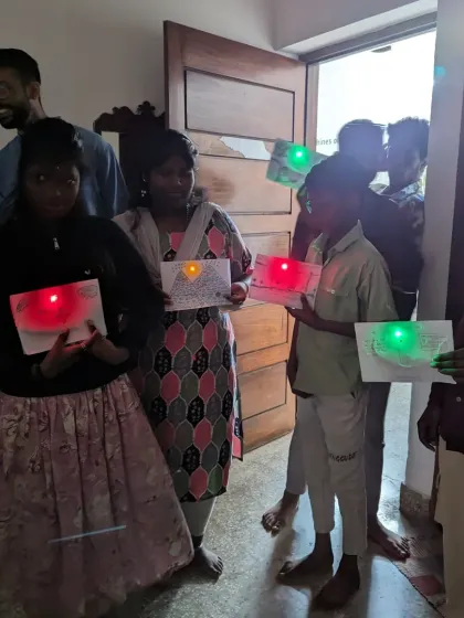 The magic moment when a circuit works! These students are proudly showing off the light-up cards they made during a paper circuits experiment. This is one of our favorite ways to introduce electronics because the result is instant, visual, and so rewarding.