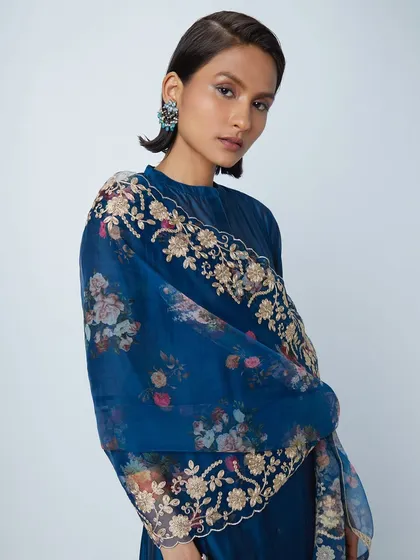 A sophisticated look for Westside's Indian wear collection. The makeup features a subtle graphic liner and the hair is styled in a short, chic bob, creating a modern and edgy feel.