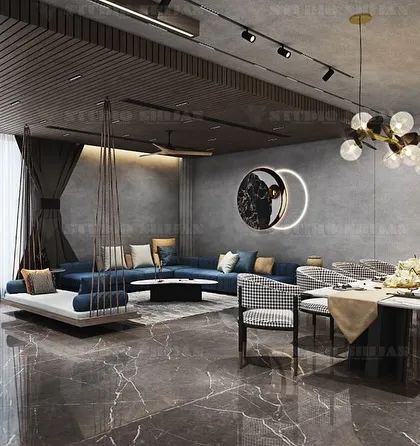 A party hall in Palam Vihar that includes a long dining table for hosting large events. The industrial-chic design features exposed concrete walls and modern lighting.