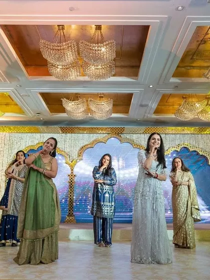 The bride's squad in a classic Bollywood pose. We choreograph these picture-perfect moments into every routine.