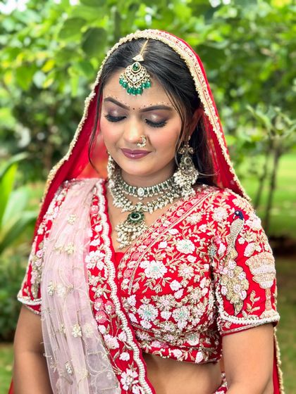 A close-up on the makeup, showing the soft, shimmery eyeshadow and flawless base that enhances her features without overpowering them.