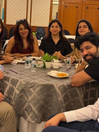 More laughter and conversation with colleagues at the retinal discussion event. Building strong relationships within the dermatology community is essential for professional growth.