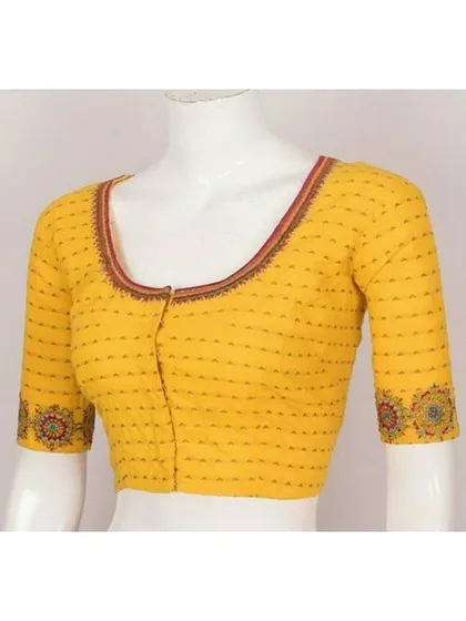 A simple, well-fitted blouse is a wardrobe essential. This yellow cotton blouse shows my commitment to classic designs, featuring a clean round neck and subtle embroidery on the sleeve cuffs for a timeless look.