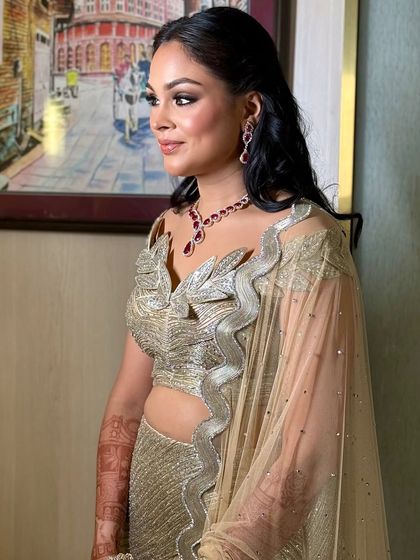 The final Sangeet look, with soft waves and a simple side part.