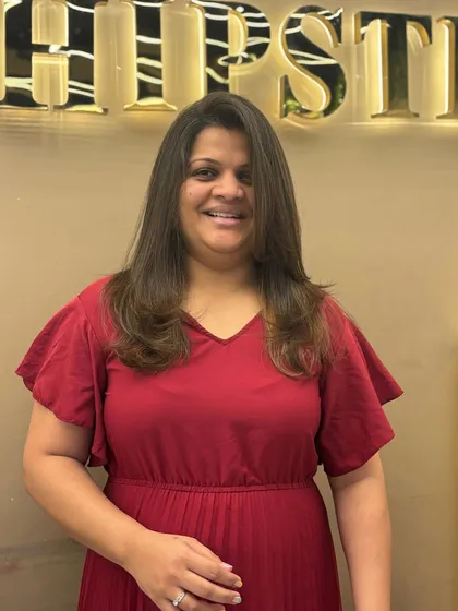 A happy client with her new hair color and cut. The style is simple, elegant, and perfect for her.