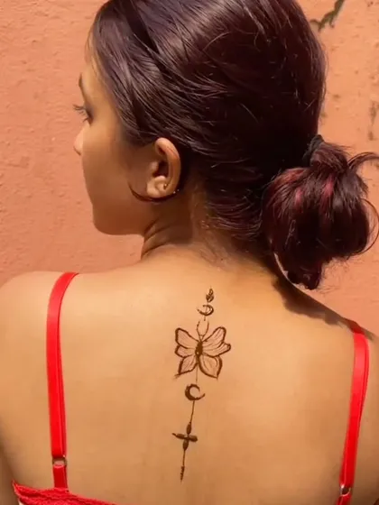 Henna isn't just for hands. I also create temporary tattoo designs for the back, shoulders, or legs. This butterfly design is a perfect example of a simple yet beautiful body art piece.