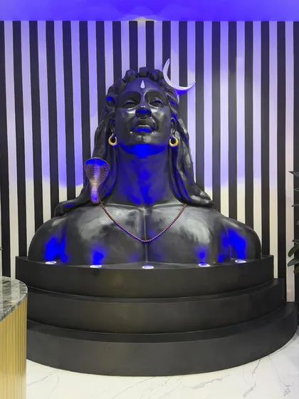 The Shiv mural fully installed and illuminated with custom blue lighting. This view shows how the sculpture commands the space and sets a devotional, inspiring tone.