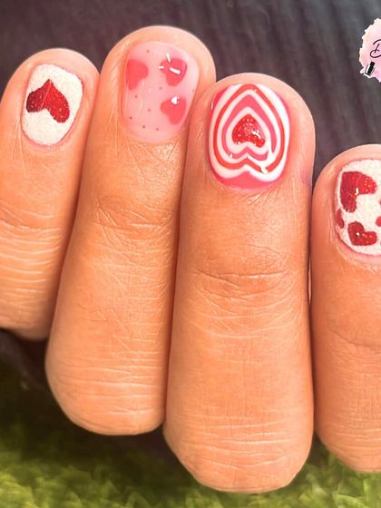 Because love looks better in pink and red. This Valentine's Day set features four different heart-themed designs, from glittery to graphic.