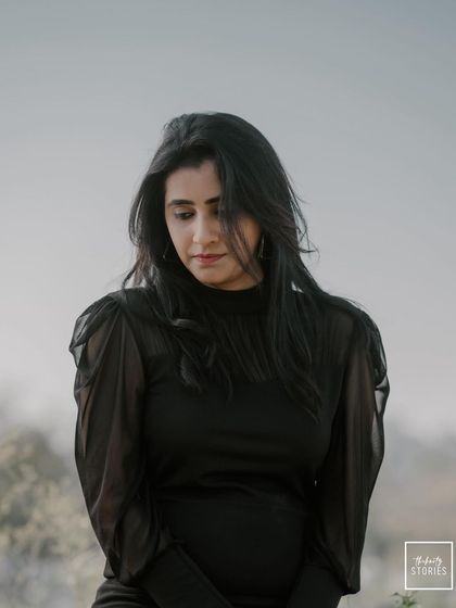 A thoughtful portrait of the bride-to-be in a beautiful outdoor setting. This solo shot captures her elegance and personality as part of the couple's story.