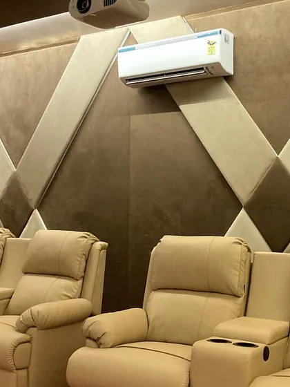 Comfort is just as important as the audio and video. For this theater in Firozabad, I installed plush recliners on a raised platform and used custom acoustic wall panels to balance the room's sound perfectly.