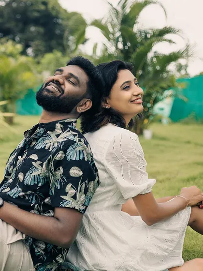 A candid shot of the couple enjoying a lighthearted moment together, their smiles radiating pure happiness.