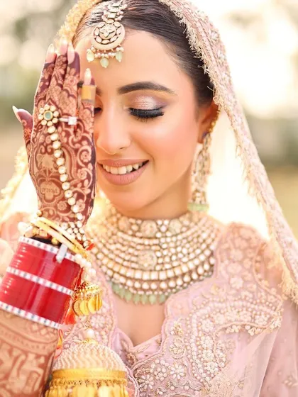 That happy bride glow. It's the best feeling to see my work become a part of such a special day. This bride's intricate henna beautifully complements her jewellery and smile.
