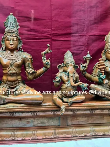 This Shiva Parivaram set, featuring Lord Shiva, Parvati, and Ganesha, is finished with an antique green oxide patina. This finish gives the sculpture a timeless, venerable appearance, reminiscent of ancient temple idols.
