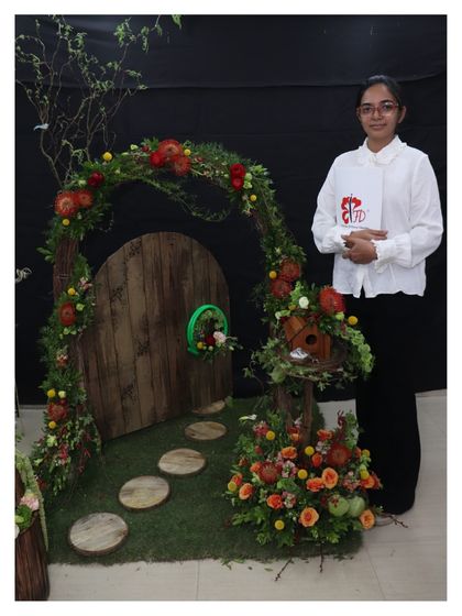 A whimsical Hobbit-inspired floral door created by a graduating student. This imaginative final project combines structural work, detailed floral application, and creative storytelling.