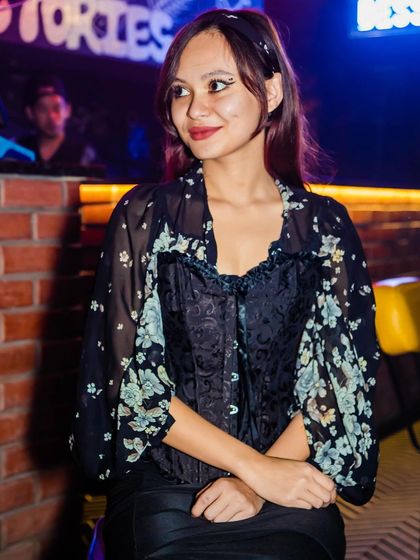 A guest posing at the bar.