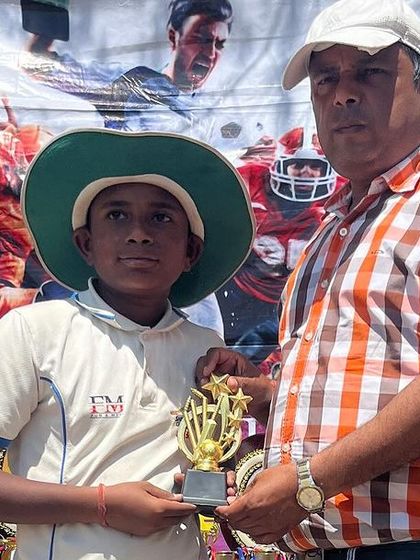 Sumit, our Best Bowler, with his trophy.
