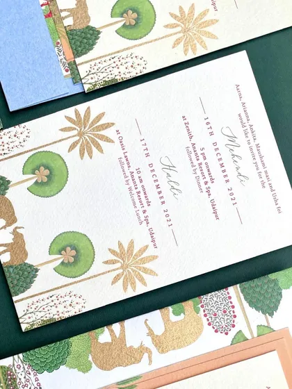 Another event card from the handmade paper suite. The illustrations of deer and stylized trees, combined with the rich texture of the paper, create a design that feels both earthy and elegant.