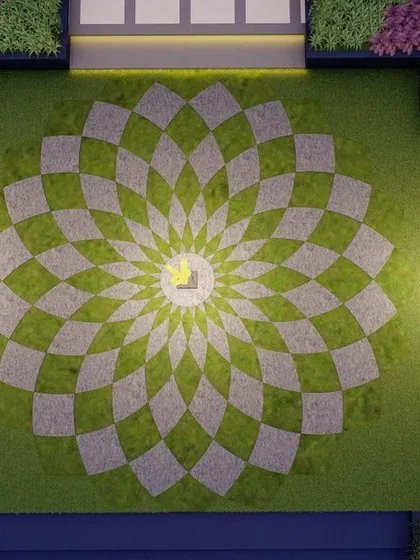 An aerial view of a lawn with an intricate geometric paving pattern, creating a 'lawn carpet' effect. This unique design element, illuminated at its center, turns the green space into a work of art, especially when viewed from above.