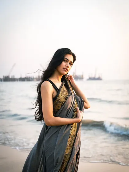 This shot includes the distant view of the sea link, grounding the ethereal beach scene firmly in Mumbai.