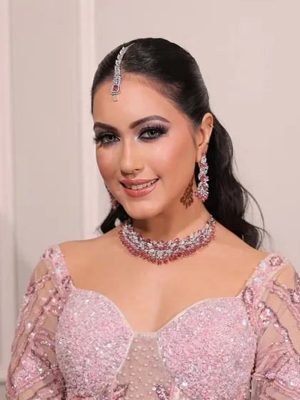 Soft glow, timeless beauty. This engagement look in a pink sequined gown is perfect for a modern bride who wants to look effortlessly elegant.