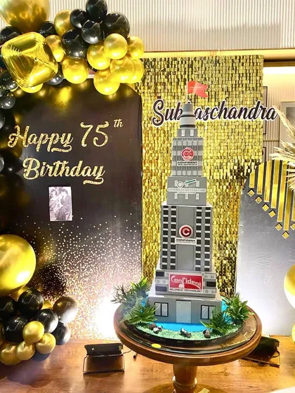 The building cake as the centerpiece of the party's decor. It was a true showstopper.