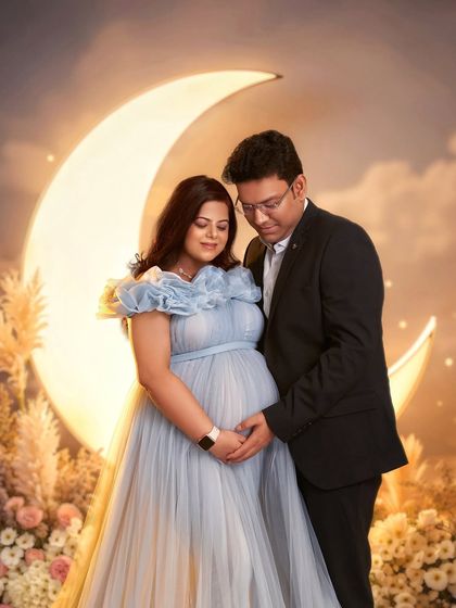The Elsa gown paired with our glowing moon prop. This combination is one of our most requested setups for creating a dreamy, over-the-moon maternity announcement.
