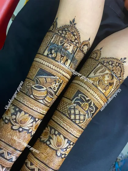 A full view of a bridal design with portraits of Radha and Krishna. This is a beautiful option for couples who want to incorporate spiritual elements into their wedding mehndi.