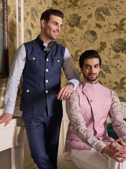 A friendly moment between two well-dressed guests. This image shows how different personalities can be expressed through my versatile designs while maintaining a cohesive aesthetic.