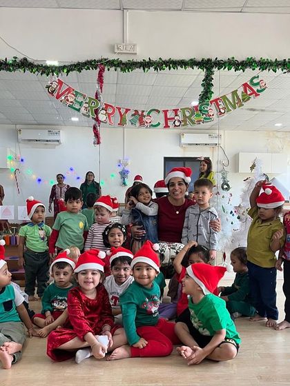 A very Merry Christmas from our little musical family. Look at all those happy faces in their Santa hats after a fun-filled class of carols and celebration.