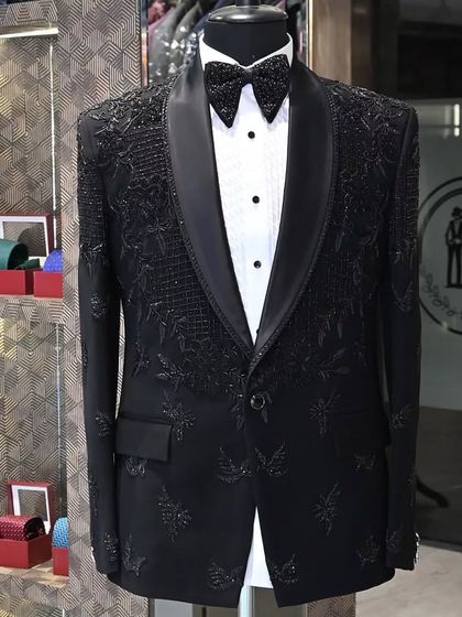 A still image of the black tuxedo with detailed floral embroidery, a sophisticated and elegant choice.