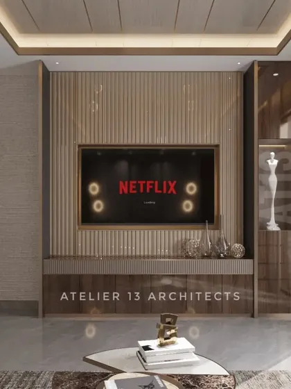 This custom TV unit was designed to reflect the client's persona, using a combination of fluted veneer, leather, glass, and metal. It’s a functional piece that doubles as a work of art.
