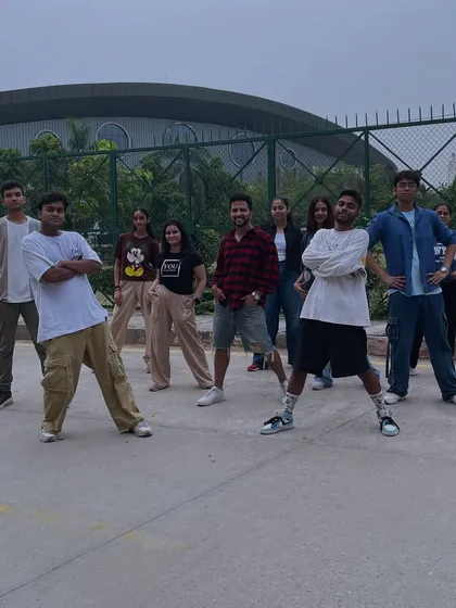 The squad is ready to dance. This photo captures the cool and confident attitude of our adult performers before a video shoot.