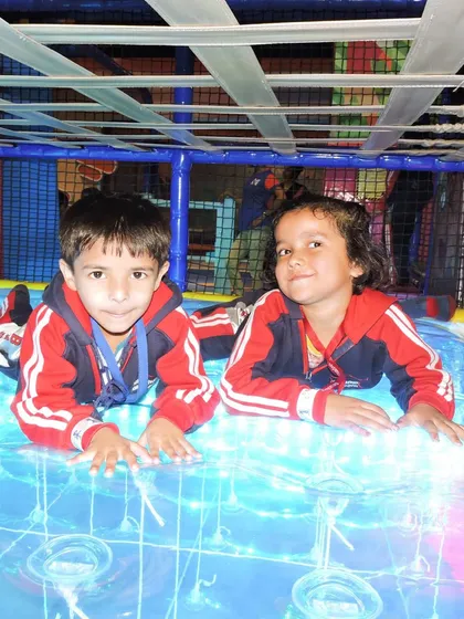 Two students enjoying the light-up sensory floor. Our play areas offer unique experiences that combine physical activity with sensory stimulation.