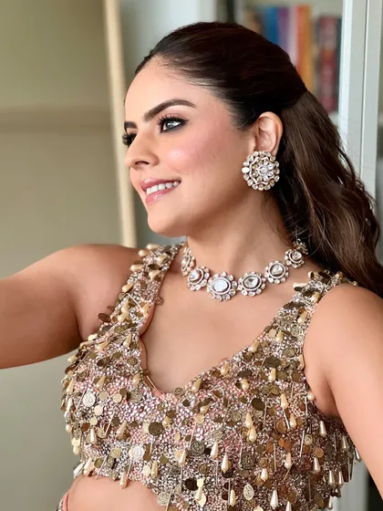 A happy, glowing shot of this cocktail party look. The makeup is radiant and fresh, perfectly complementing the sparkling outfit and diamond jewellery.